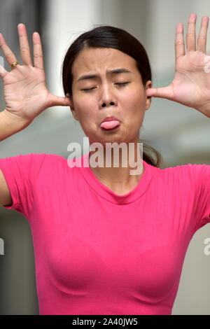 Filipina Woman Making Funny Faces Stock Photo Alamy