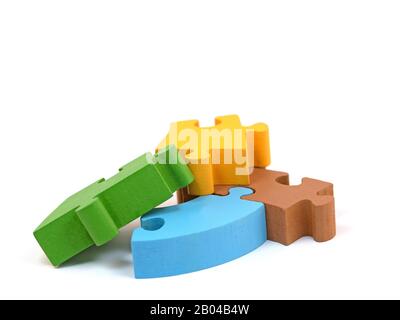 Wooden Jigsaw Pieces Isolated Against A White Background Stock Photo