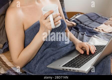 Attractive Naked Woman Sitting Covered With Towel Front View Stock