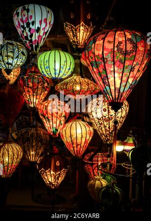 Colorful Red Chinese Lanterns Are Lighted At Night While Hanging At A