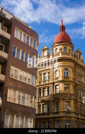 Contrast Between Modern Apartment Building And Traditional Building In