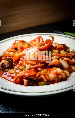 Barbecue Baby Octopus With Bell Pepper And Spices Stock Photo Alamy