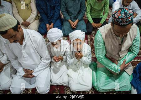 Men Praying During The Festival Of Eid Ul Fitr Being Celebrated At The