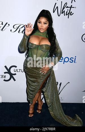 Lil Kim In Torch London Green Dress And Lil Cease Attends The 2nd