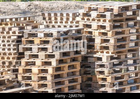 A Larger Quantity Of Stacked Wooden Pallets On The Construction Site