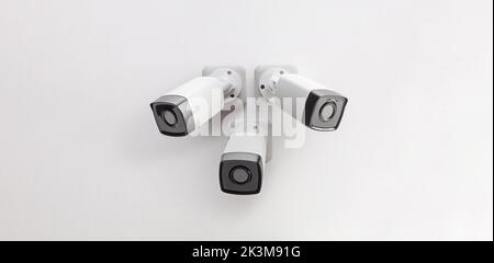 Three Security CCTV Cameras Mounted On A Pole Against Blue Sky Stock