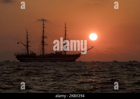 The Sunset Over The Sea Behind The Amerigo Vespucci Sailing Ship Near