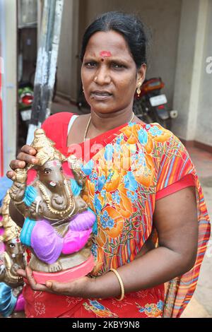 Woman Worshiping Goddess Parvati In Sri Meenakshi Amman Temple