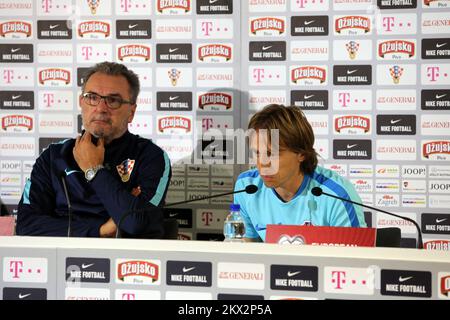 Croatian Player Luka Modric L And Coach Slaven Bilic Talk During A