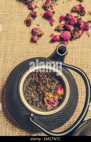 Black Cast Iron Teapot And Cup With Rose Stock Photo Alamy