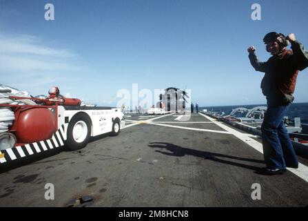 Flight Deck Crewmen Watch As A Helicopter Anti Submarine Squadron 2 HS