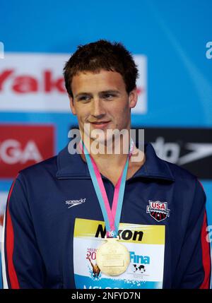 Gold Medalist Usa S Ryan Lochte Shows Off His Medal In Metres