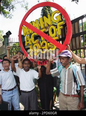 Protesters Clench Their Fists During A Protest Denouncing Burial Of