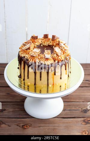 Gorgeous Snickers Cake With Peanut Butter Cream Melted Chocolate