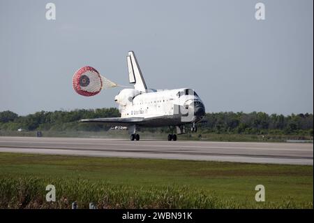 With Drag Chute Unfurled Space Shuttle Discovery Lands On Runway At