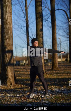 Mature Recreational Runner Warming Up And Stretching Before Running In