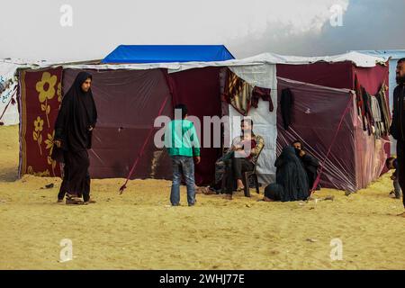 Rafah Gaza Th Feb Displaced Palestinians Sit In Front Of A