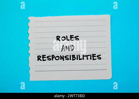 Roles And Responsibilities Words Written On Torn Yellow Paper With