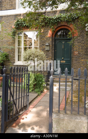 Paved Brick Garden Path Leading To Sundial In Circular Paved Area