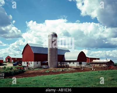 Wisconsin Dairy Farm Showing Red Barn Silos And Outbuildings Stock