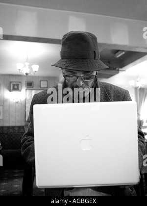 Mature Man With Laptop In Pub Stock Photo Alamy