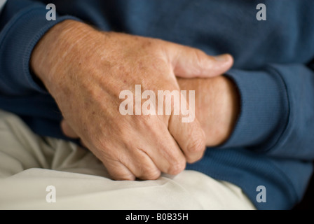 Male Pensioner Clasping Hands Stock Photo Alamy