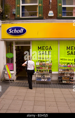 Scholl Shoe Store With Shoes In Sale Outside Shop On Rack Stock Photo