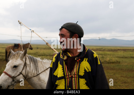 a-mongolian-herder-with-his-horse-in-the