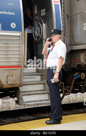 Amtrak Railroad Conductor Communicating With Train Driver America USA