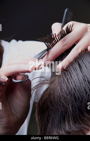 Male Short Trimmed Brunette Hair And Light Stubble Wearing A White V