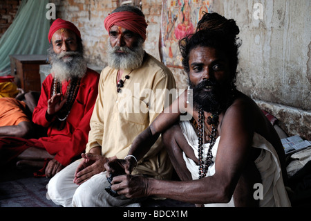 Friendly Sadhu Hindu Hindi Holy Men Posing With One Leg Behind Head