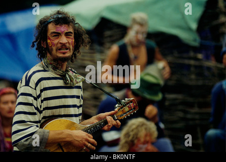 Middle-aged man with his face painted as a tiger and his ...