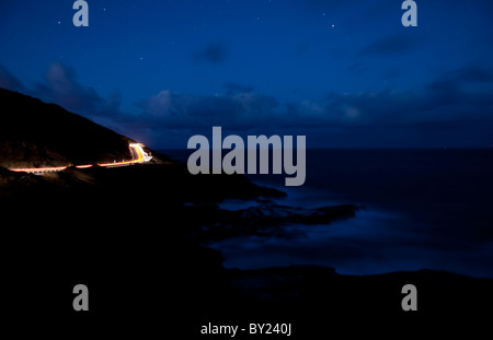 Hawaii Honolulu Night Shot Of Waves And Traffic On Lonely Winding Road