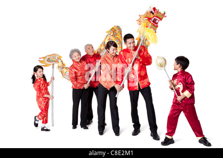 Family Dressed in Traditional Clothing Celebrating Chinese New Year