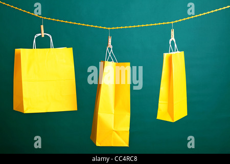 Paper Shopping Gift Bags On Green Background Ecologocal Stock Photo Alamy