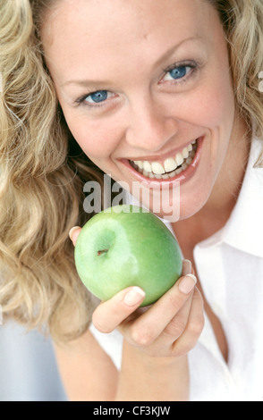 Cropped Female Long Wavy Blonde Hair Wearing Subtle Make Up And White