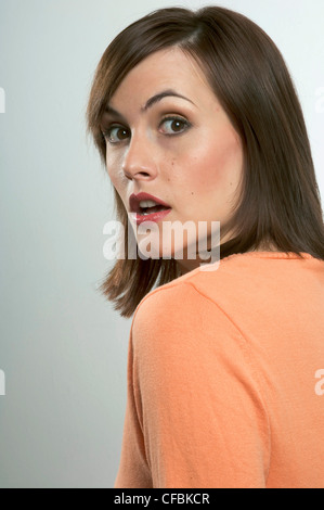 Female With Straight Shoulder Length Red Hair Crouched Naked By A