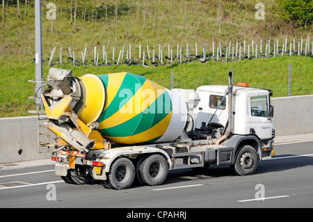 Ready mixed concrete delivery lorry and dumper truck on construction