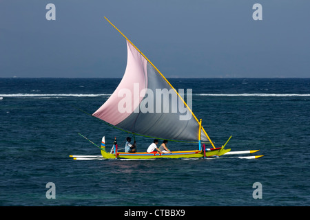 A Traditional Balinese Outrigger Sailing Fishing Boat Called A Jukung