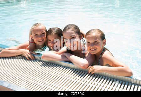 Group Of Girls On The Edge Of A Public Swimming Pool Stock Photo Alamy