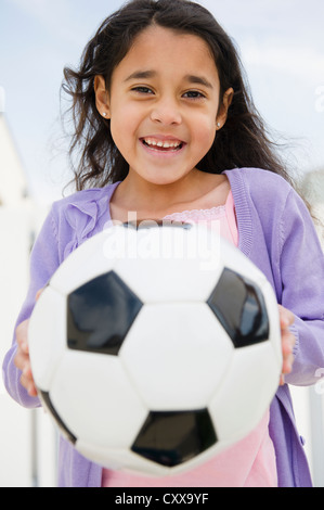 Brunette Hispanic Girl Holding Soccer Football Ball With Happy Face