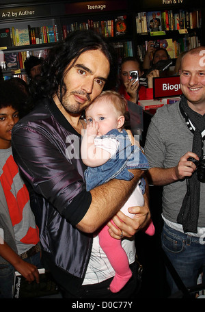 russell brand bristol russell brand cuddles a baby as he visit s a waterstone s russell brand bristol russell brand cuddles a baby as he visit s a waterstone s