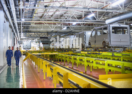 Factory Workers At The Assembly Line Stock Photo Alamy