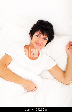 Bright Woman Relaxing Lying On Her Bed Stock Photo Alamy