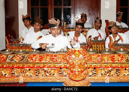 Musicians Of A Traditional Balinese Gamelan Ensemble Preparing For A ...