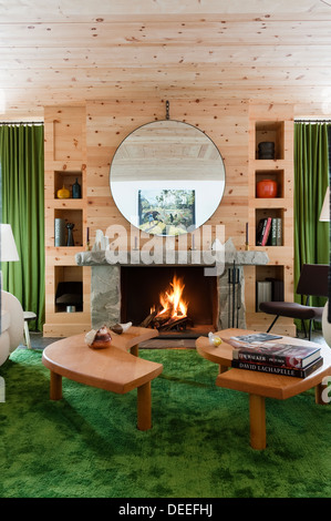 Stone fireplace in panelled living room with beamed ceiling stock ... Désign chalet Fireplace