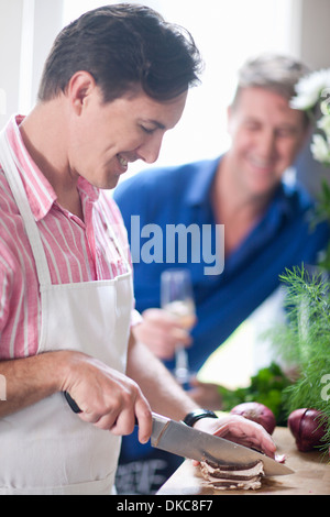 Man Chopping Red Onion With Knife Stock Photo Alamy