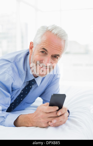 Relaxed Mature Man Text Messaging At Home Stock Photo Alamy