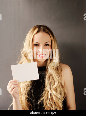 Girl Holding Blank Piece Of Paper Stock Photo Alamy