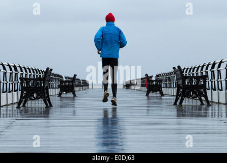 Mature Man Jogging On Saltburn Pier In The Rain Saltburn By The Sea